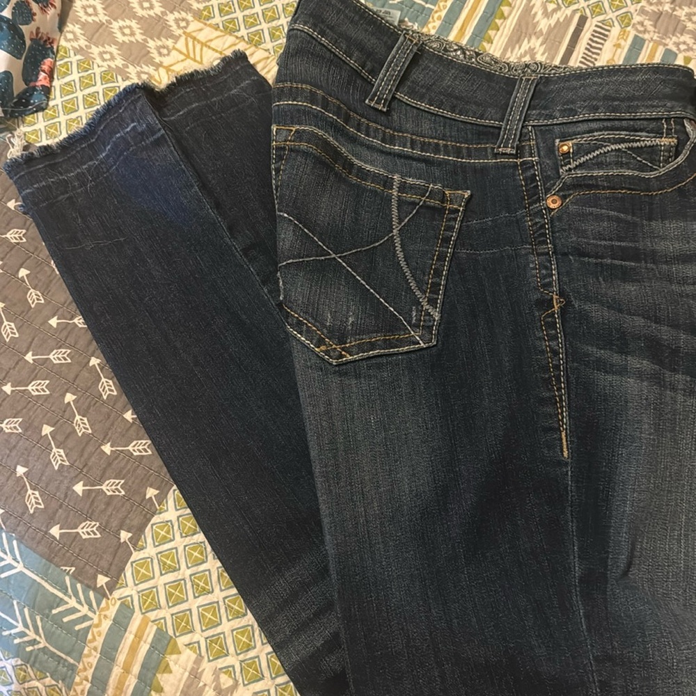 Ariat 31R jeans with distressed bottom seam